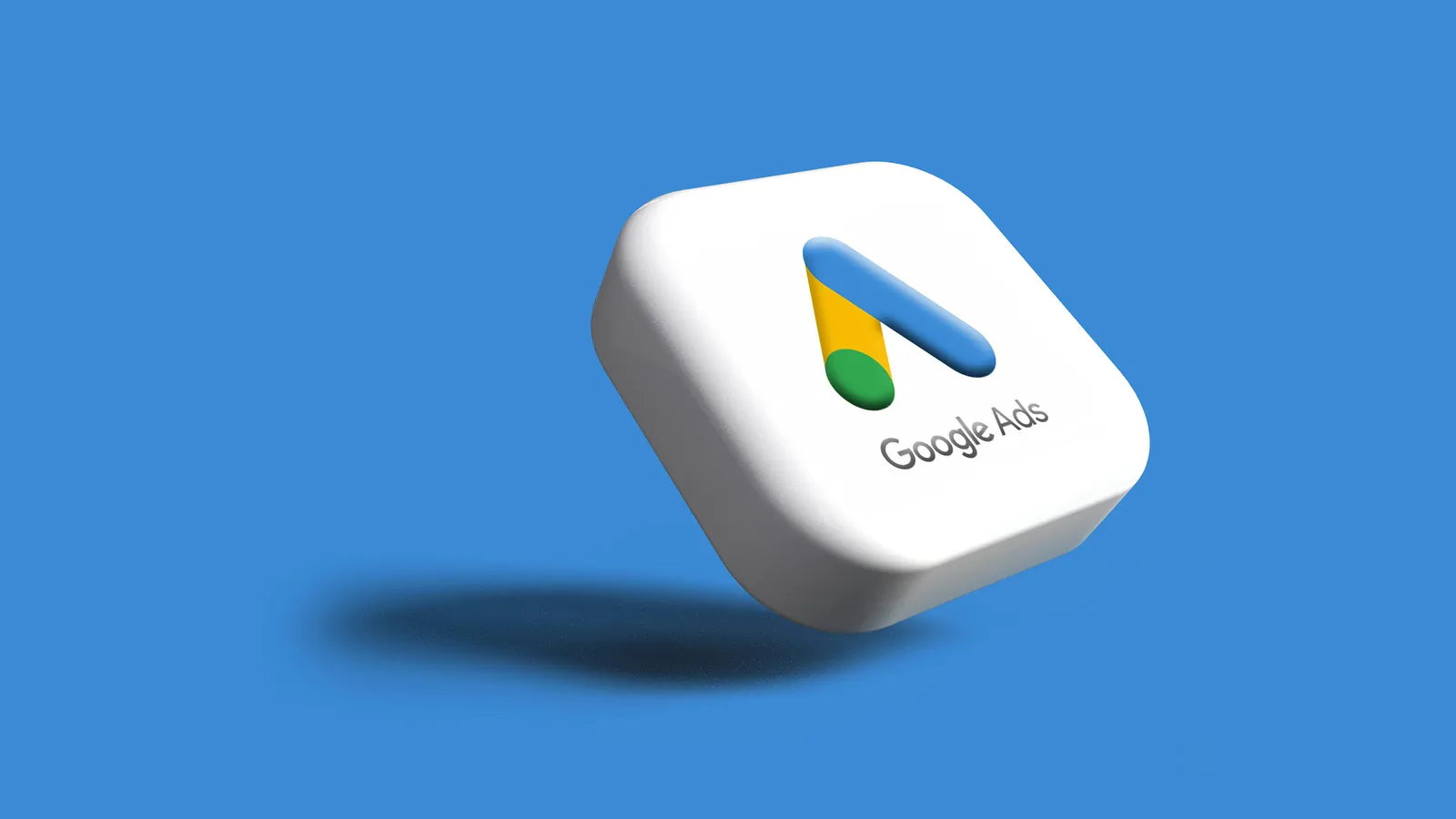 3D white rounded app tile with the Google Ads logo floating against a solid blue background, casting a soft shadow